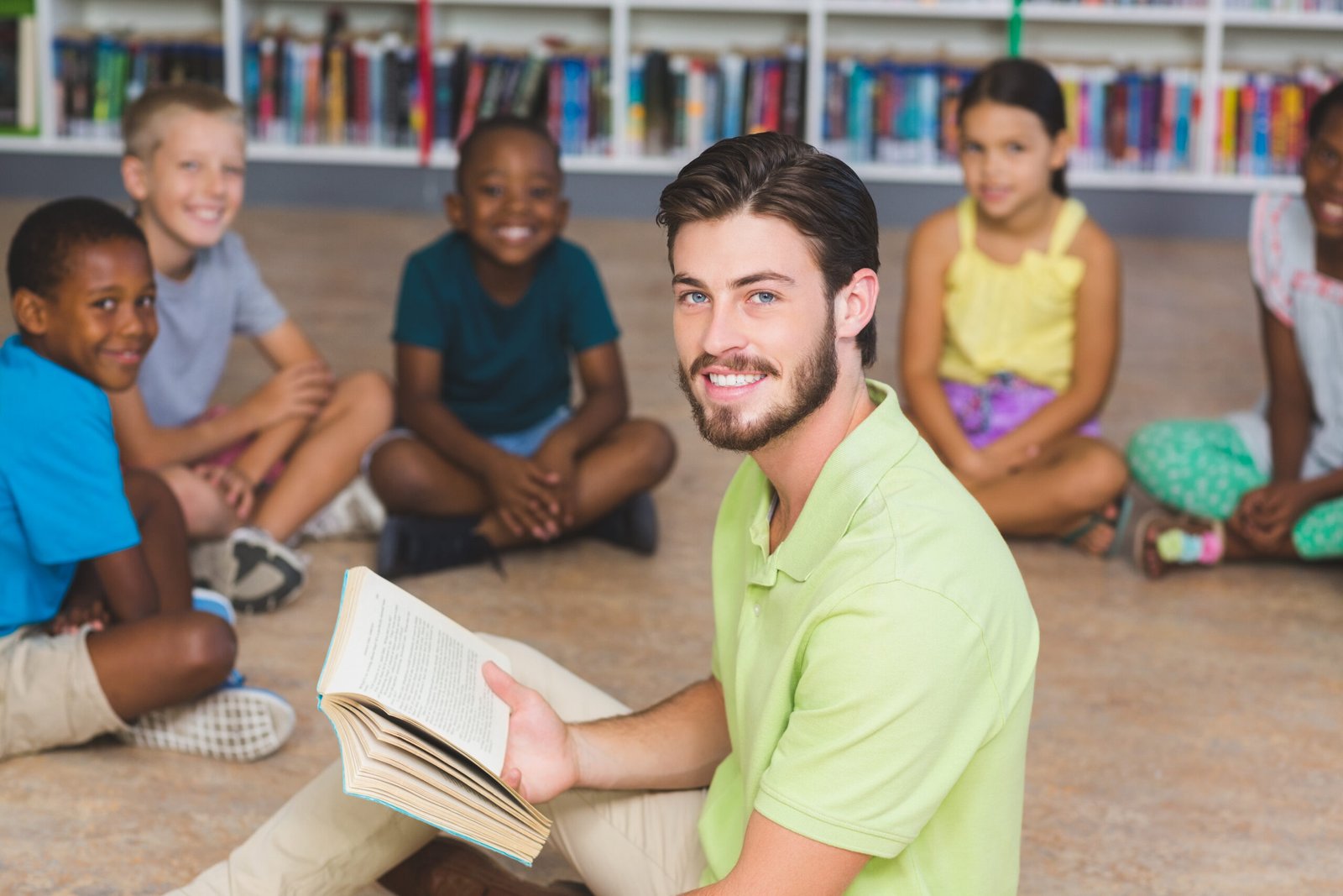 Teacher teaching kids in library