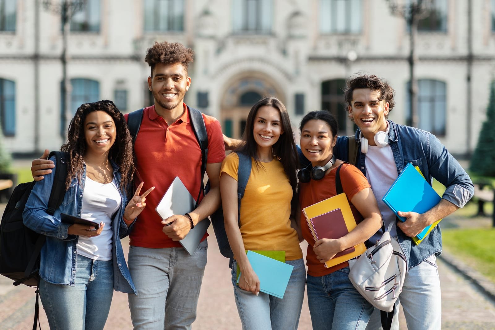 53630240_group-of-happy-international-students-posing-outdoors-near-university-building